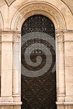 old woodcut door and stone wall detail in Vienna