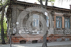 Old wooden abandoned building with carving in