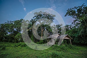 Old wooden abandoned cottage against sky