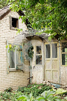 Old wooden abandoned house with windows and doors