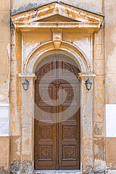 Old wooden arch door