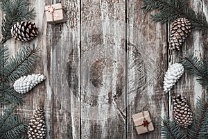 Old wooden background. Fir branches, cones. Christmas Fellowship, New Year and Xmas. Space for Santa`s message and holidays.