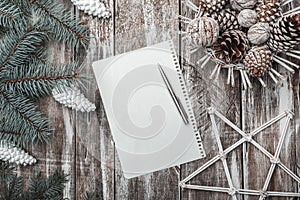 Old wooden background. Green fir branches white cones. Christmas card, Christmas and New Year`s Eve. Letter to Santa.