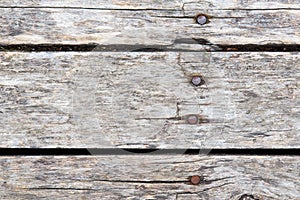 Old wooden background with horizontal weathered boards and rusty nails