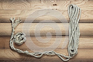 Old wooden background with ship rope