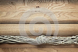 Old wooden background with ship rope