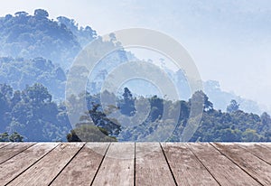 Old wooden balcony terrace on viewpoint high rainforest layer mountain with white fog in early morning