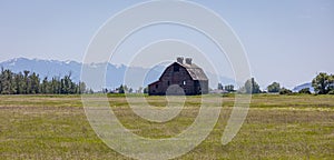 Old wooden barn in a field in Montana.