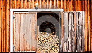 Old wooden barn with firewood