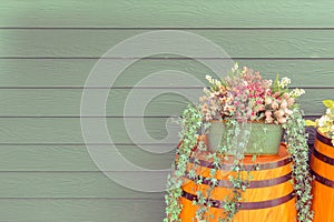 Old wooden barrel with beautiful flowers