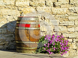 Old wooden barrel and flowers