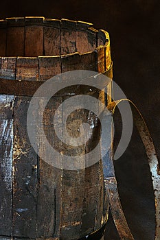 Old wooden barrel and an iron hoop