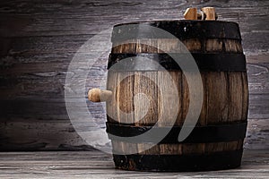 Old wooden barrel standing on table