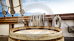 Old wooden barrel table background and space for your decoration. Old ship and ocean landscape background.