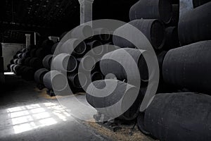 Old wooden barrels of sherry in bodega