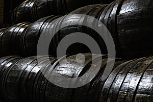 Old wooden barrels for whiskey or wine