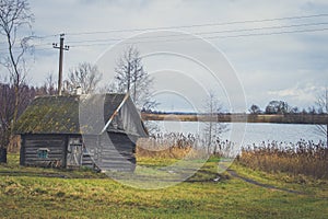 Old wooden bath on the lake shore