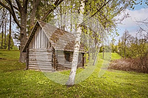 Old wooden bathhouse in rural area