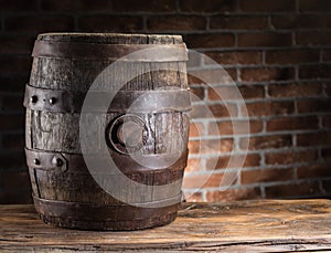 Old wooden beer cask on the table. Craft brewery