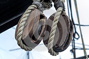 Old wooden block pulleys and rope