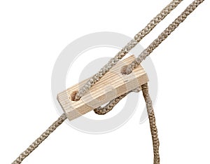 Old wooden block with rope