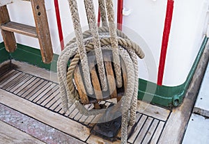 Old wooden block with rope