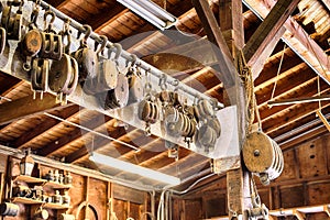 Old wooden Block and tackle pulleys in a boat builders shop