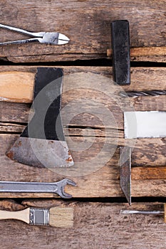 Old wooden board with various building instruments.