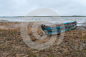 Old wooden boat ashore