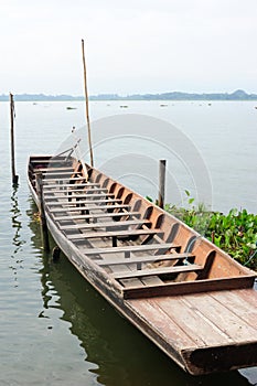 Old wooden boat in the lake