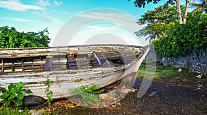 An old wooden boat lying on beach