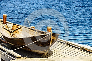 Old boat on pier, norway fjord