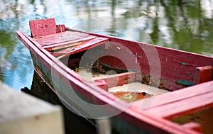 The old wooden boat on the river