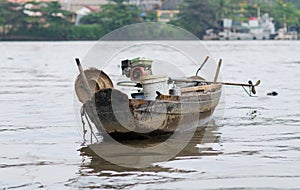 Old wooden boat on Saigon River