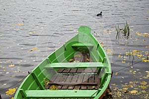 Old wooden boats near the beach of Trakai Gavle lake . Autumn and fall time