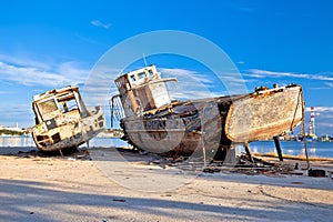 Old wooden boats wreck decay by the sea