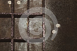 Old wooden box with cells. shelves in a black wooden rack. empty toolbox