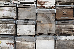 Old wooden boxes background. Old beehives.