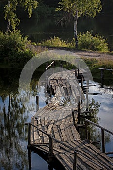 Old wooden bridge above the river