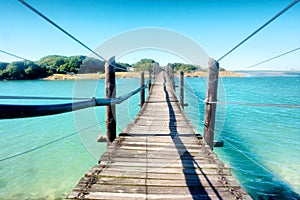 Old wooden bridge across the lagoon