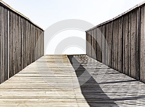 An old wooden bridge leading to nowhere. Concept of alone sadness walk to emptiness. Selective focus
