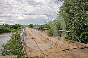 Old wooden bridge over Sluch river in Rivne region, Ukraine