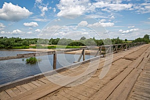 Old wooden bridge over Sluch river in Rivne region, Ukraine