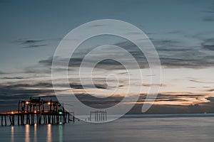 The old wooden bridge pier at sunset