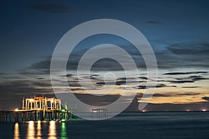 The old wooden bridge pier at sunset