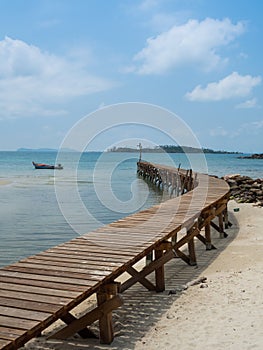 Old wooden Bridge to the blue sea