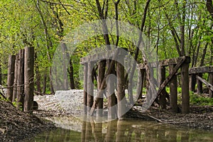 Old wooden bridge in the woods.