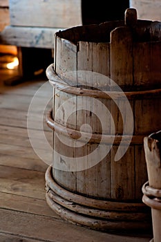 Old wooden bucket close-up in house