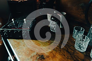 Old wooden cabinet with drinks and glaces photo