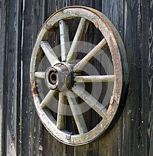 Old wooden carriage wheel.